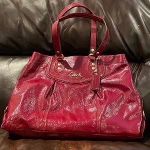 Crimson red patent leather coach bag